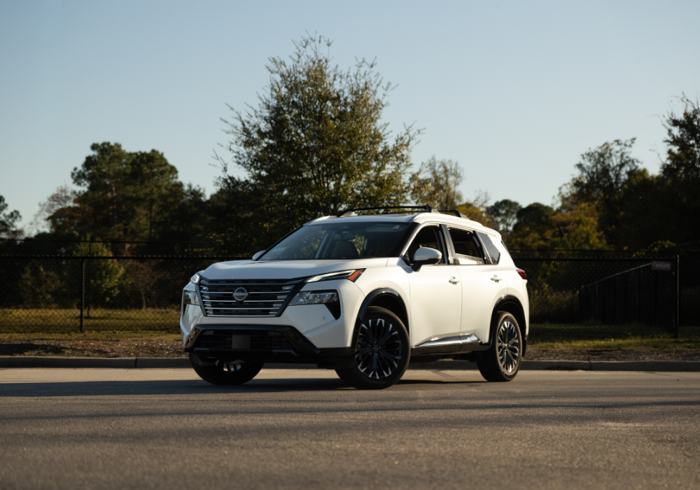 2026 Nissan Rogue parked on a paved surface with trees in the background