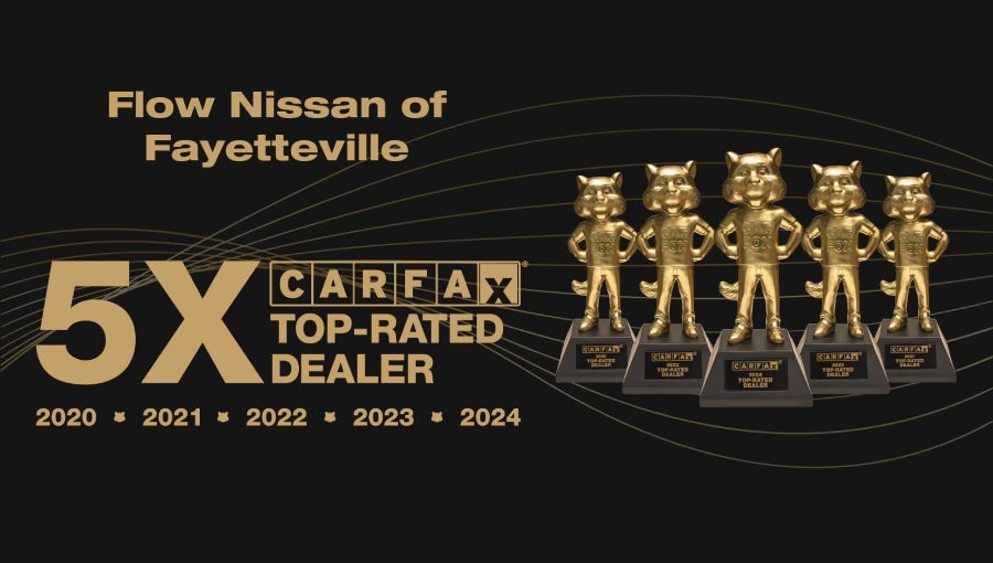 Flow Nissan of Fayetteville is a 5x CARFAX Top-Rated Dealer from 2020-2024, shown with five golden fox trophies.